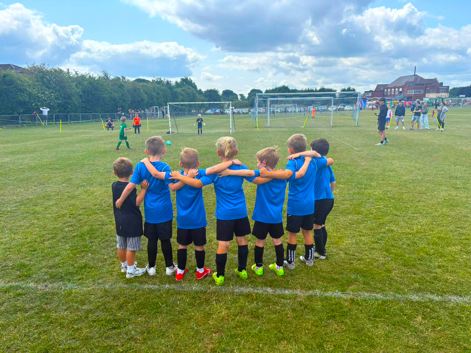Under 7s before the kick off at a football tournament